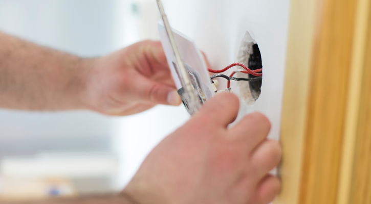 479103173_electrical rewiring-fp Handy man installing light switch